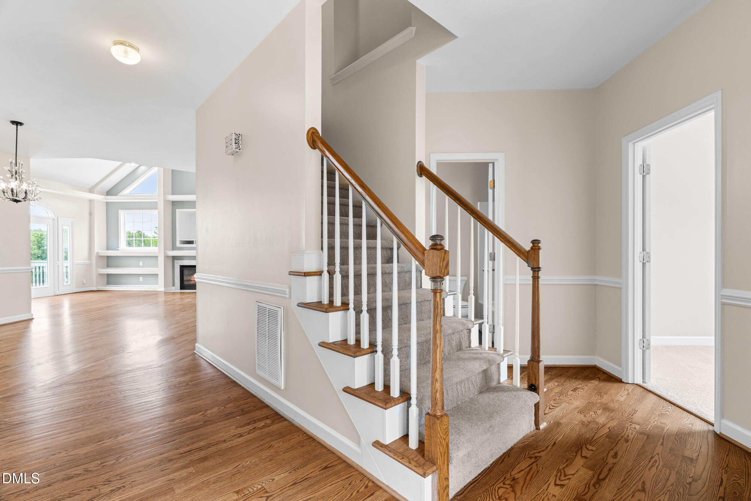 744 Seastone Street Raleigh, NC 27603 - Photo 8 of 53 a view of entryway and hall with wooden floor