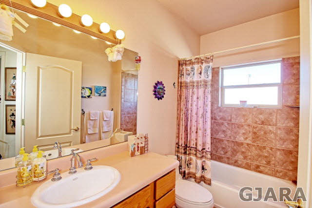 1701 O Road Fruita, CO 81521 - Photo 20 of 23 a bathroom with a sink vanity mirror and tub