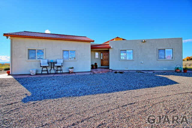 1701 O Road Fruita, CO 81521 - Photo 2 of 23 a view of a house with a backyard