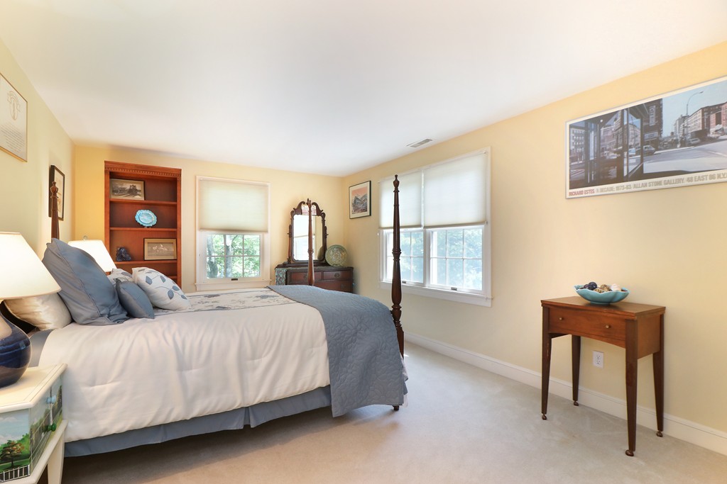 521 Marrett Road Lexington, MA 02421 - Photo 17 of 30 a bedroom with a bed and a window