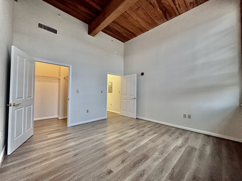 4 Bishop Street, Unit 206 Framingham, MA 01702 - Photo 13 of 28 a view of an empty room with wooden floor