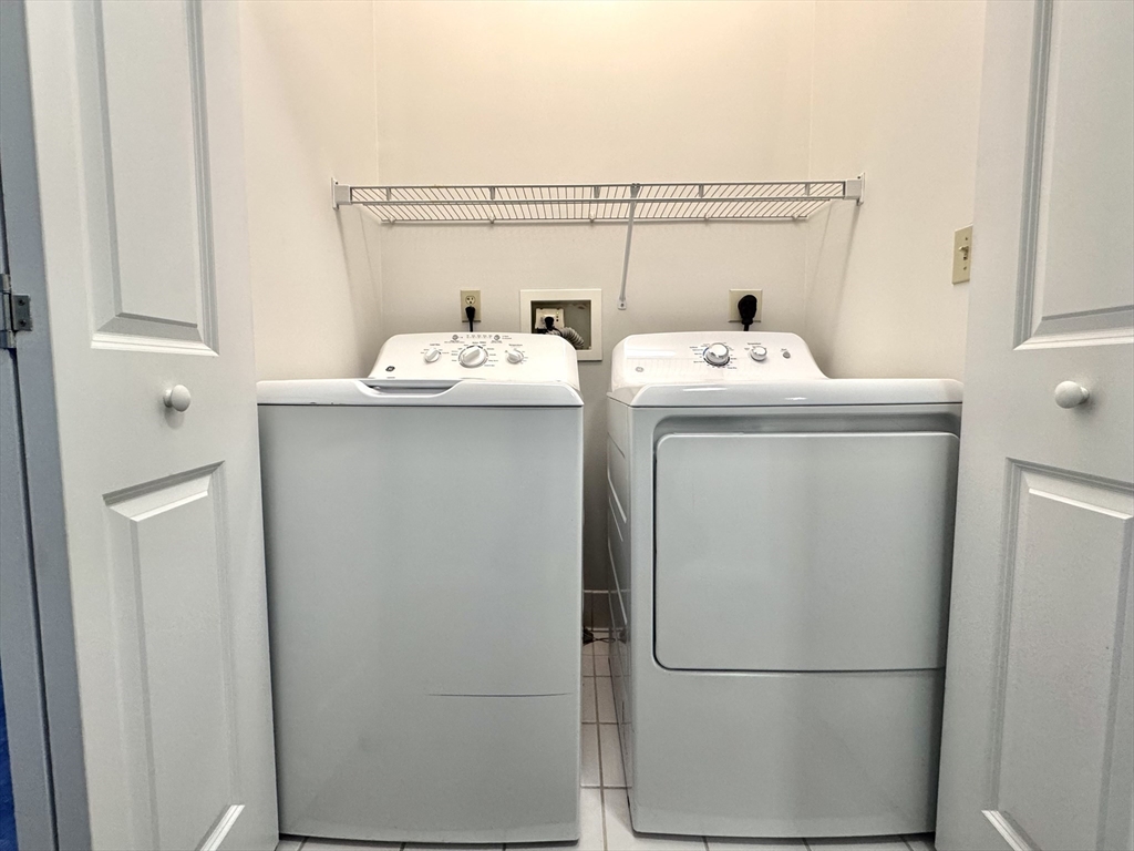 4 Bishop Street, Unit 206 Framingham, MA 01702 - Photo 10 of 28 a utility room with dryer and washer