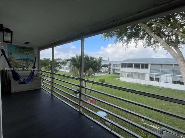 a view of a balcony with an outdoor space