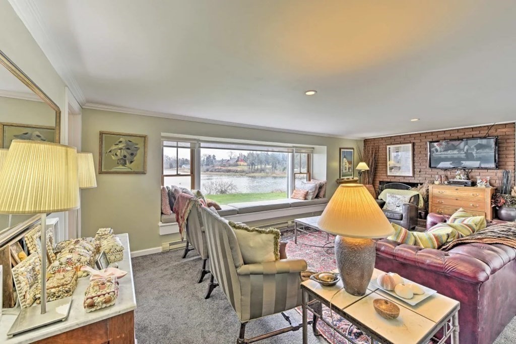 232 Lagoon Pond Road Tisbury, MA 02568 - Photo 11 of 31 a view of a living room and dining room