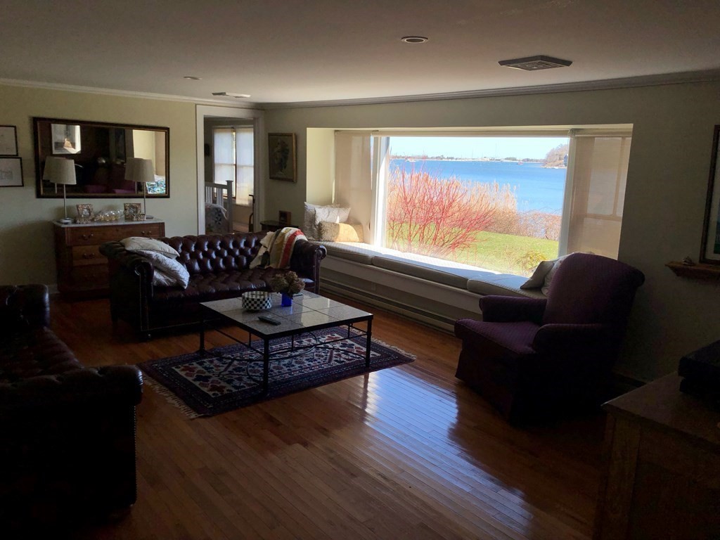 232 Lagoon Pond Road Tisbury, MA 02568 - Photo 13 of 31 a living room with furniture and a flat screen tv