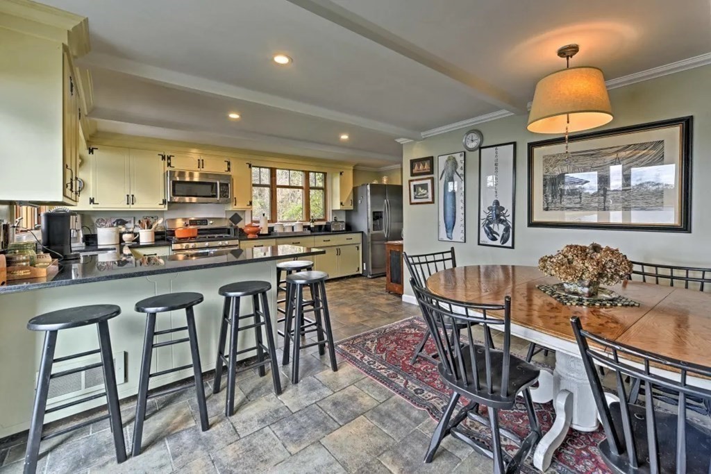 232 Lagoon Pond Road Tisbury, MA 02568 - Photo 15 of 31 a view of a dining room with furniture window and wooden floor