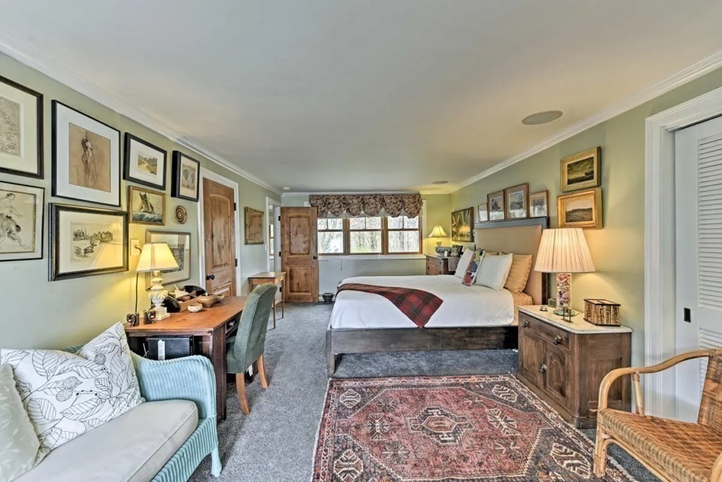 232 Lagoon Pond Road Tisbury, MA 02568 - Photo 18 of 31 a bedroom with furniture and a couch