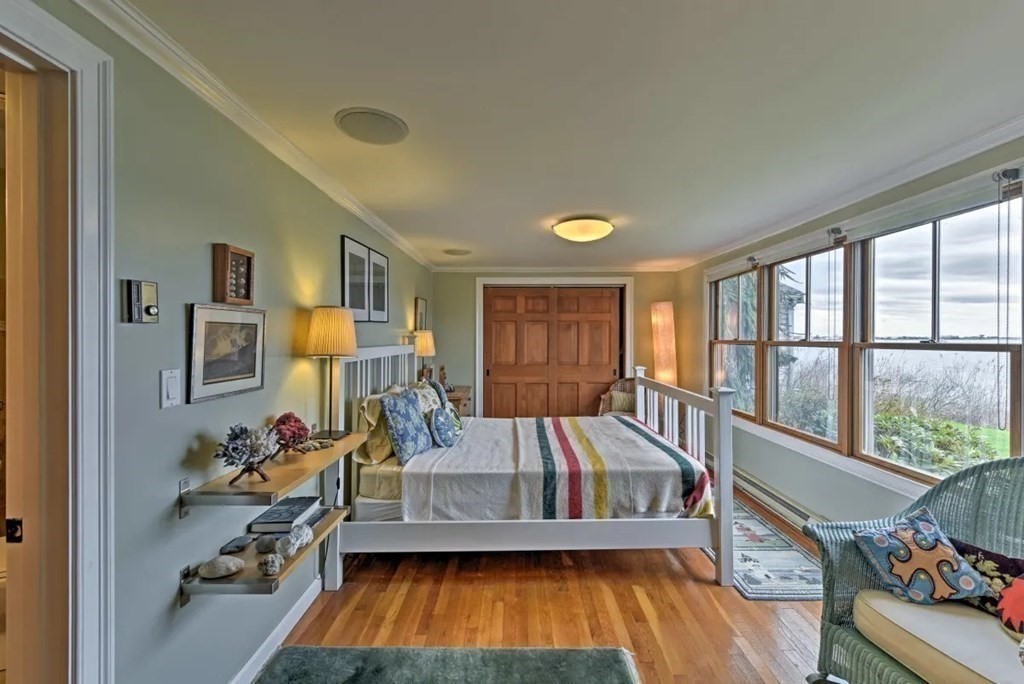 232 Lagoon Pond Road Tisbury, MA 02568 - Photo 23 of 31 a bedroom with furniture and a large window