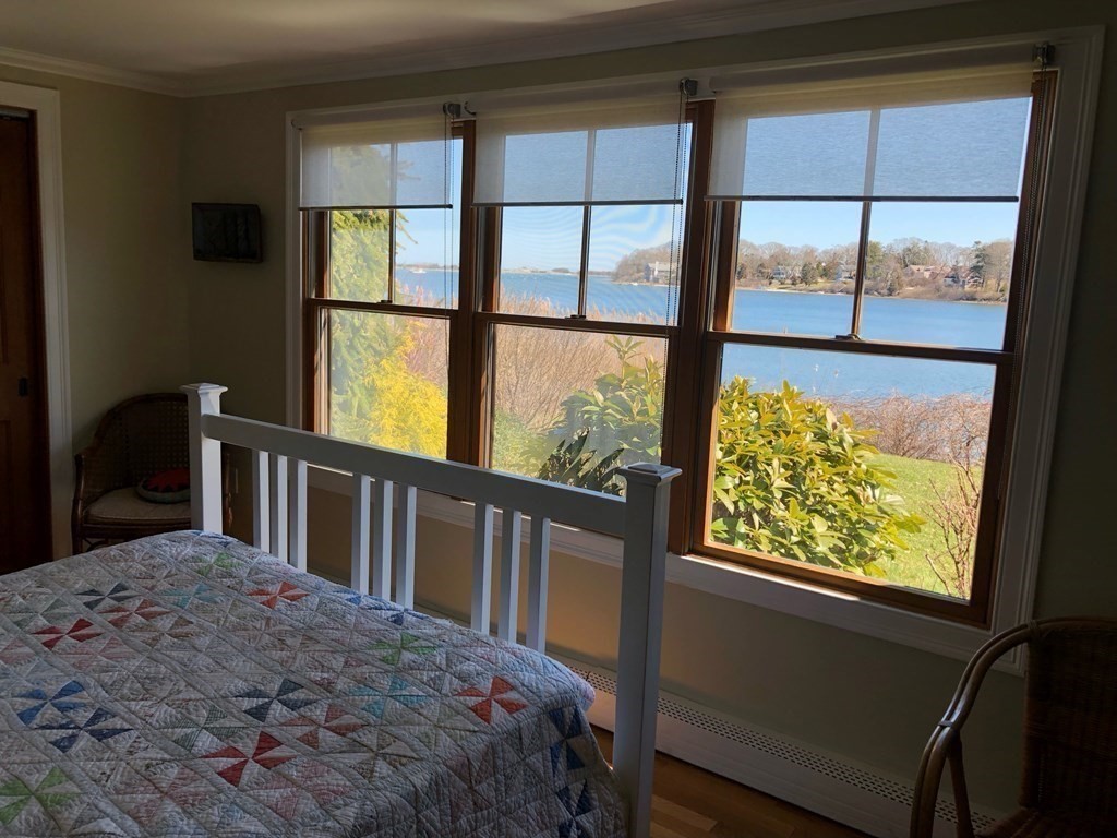 232 Lagoon Pond Road Tisbury, MA 02568 - Photo 25 of 31 a bedroom with a bed and a window