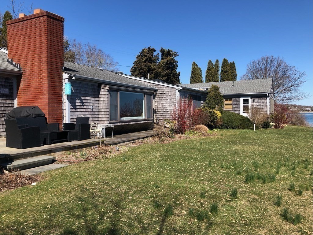 232 Lagoon Pond Road Tisbury, MA 02568 - Photo 30 of 31 a front view of a house with garden