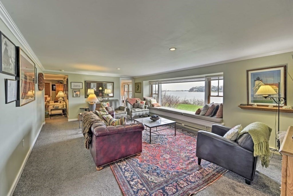 232 Lagoon Pond Road Tisbury, MA 02568 - Photo 9 of 31 a living room with furniture and a flat screen tv