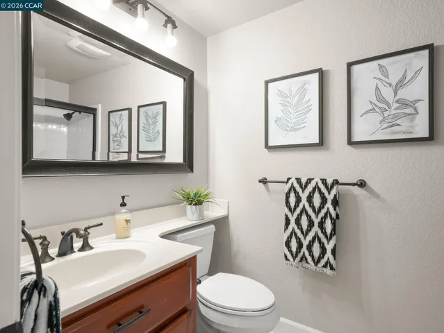 a room with furniture a rug and a window