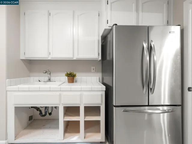 a view of a house with swimming pool and sitting area