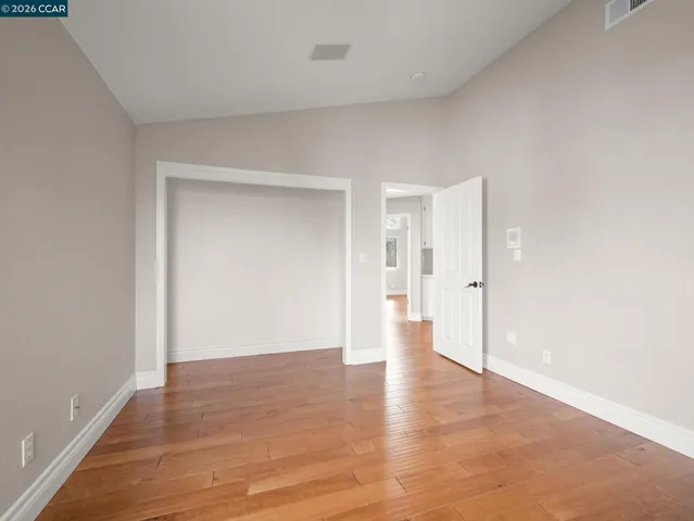 an aerial view of a house with a yard and garden