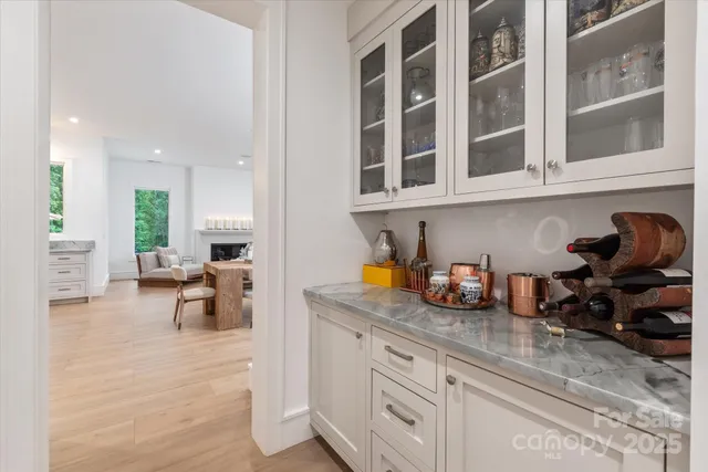 a kitchen with stainless steel appliances granite countertop a sink and cabinets