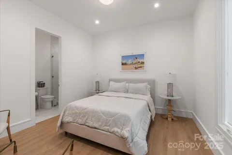 a bedroom with a bed and a table