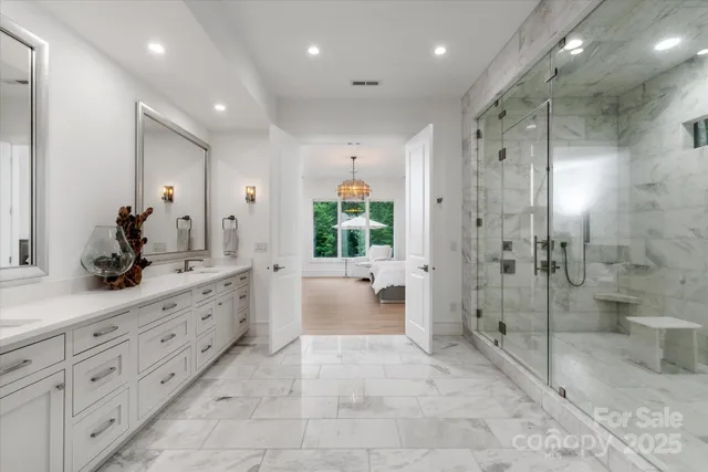 a bathroom with a double vanity sink toilet and shower