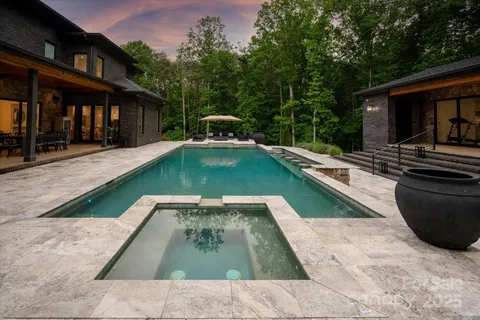 a view of swimming pool with a lounge chair