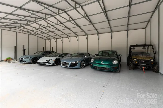 a view of a garage with parked cars