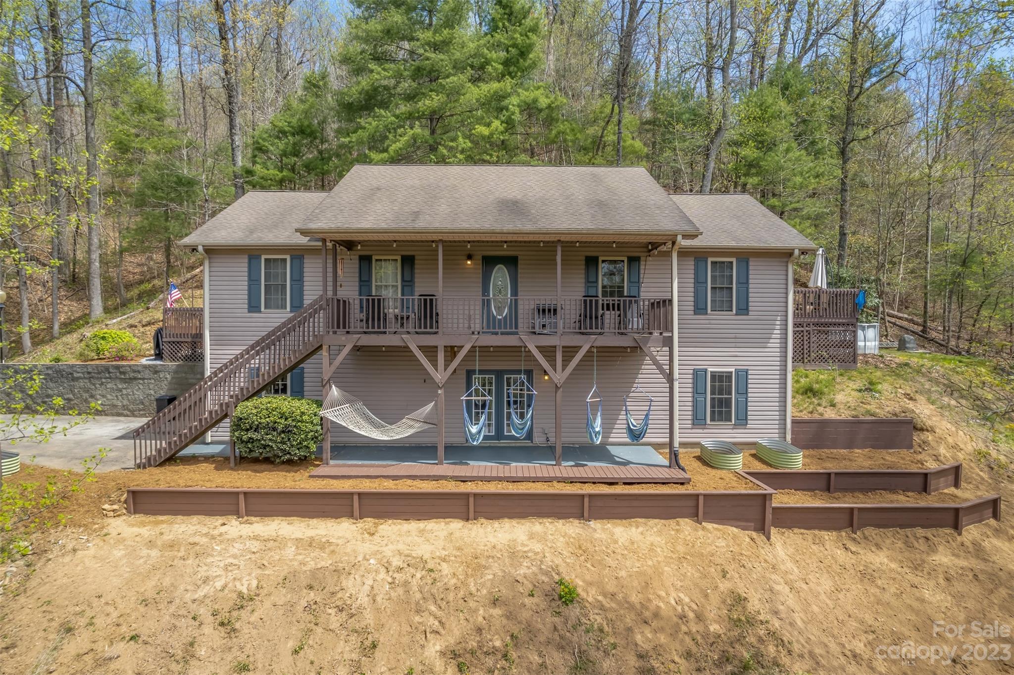 1251 Terrys Creek Road Zirconia, NC 28790 - Photo 1 of 48 a front view of a house with a yard