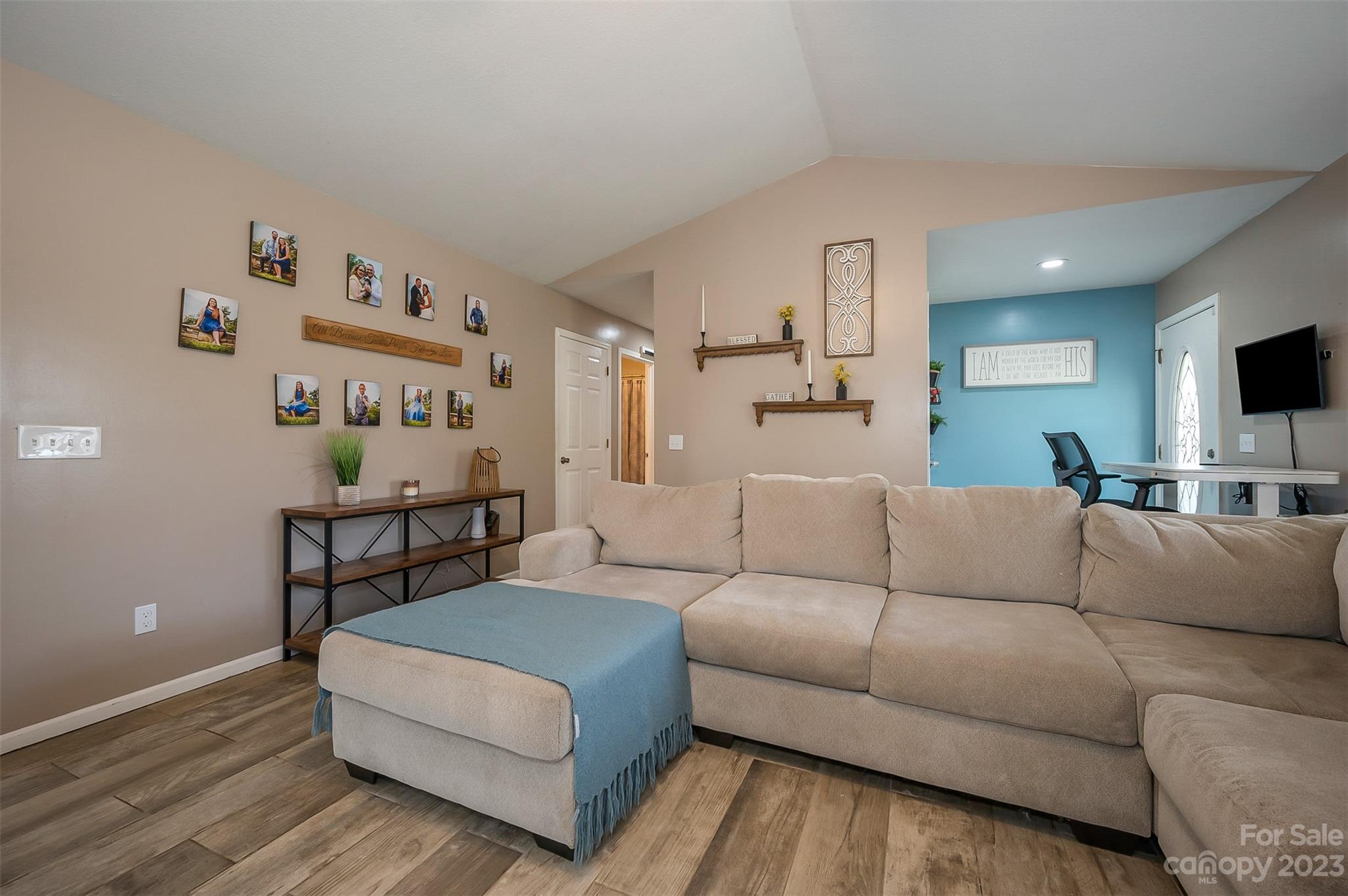 1251 Terrys Creek Road Zirconia, NC 28790 - Photo 11 of 48 a living room with furniture and a flat screen tv