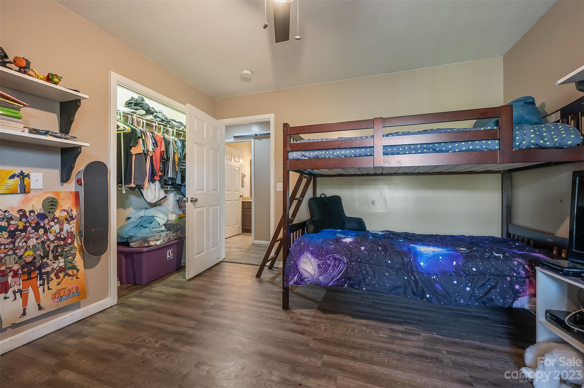 1251 Terrys Creek Road Zirconia, NC 28790 - Photo 15 of 48 a bedroom with a bed and wooden floor