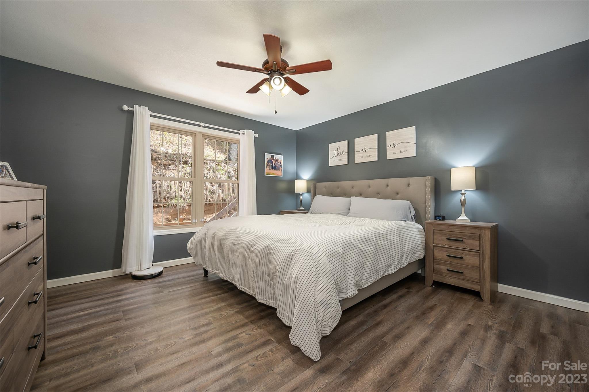 1251 Terrys Creek Road Zirconia, NC 28790 - Photo 19 of 48 a bedroom with a large bed and a window