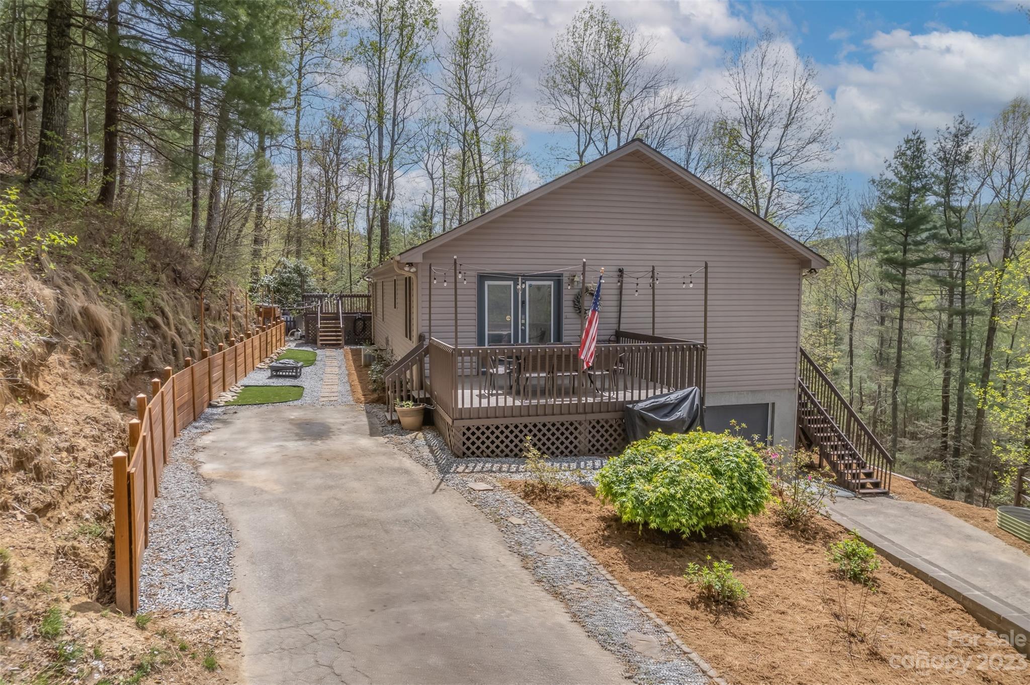 1251 Terrys Creek Road Zirconia, NC 28790 - Photo 2 of 48 a view of a house with a yard and sitting area