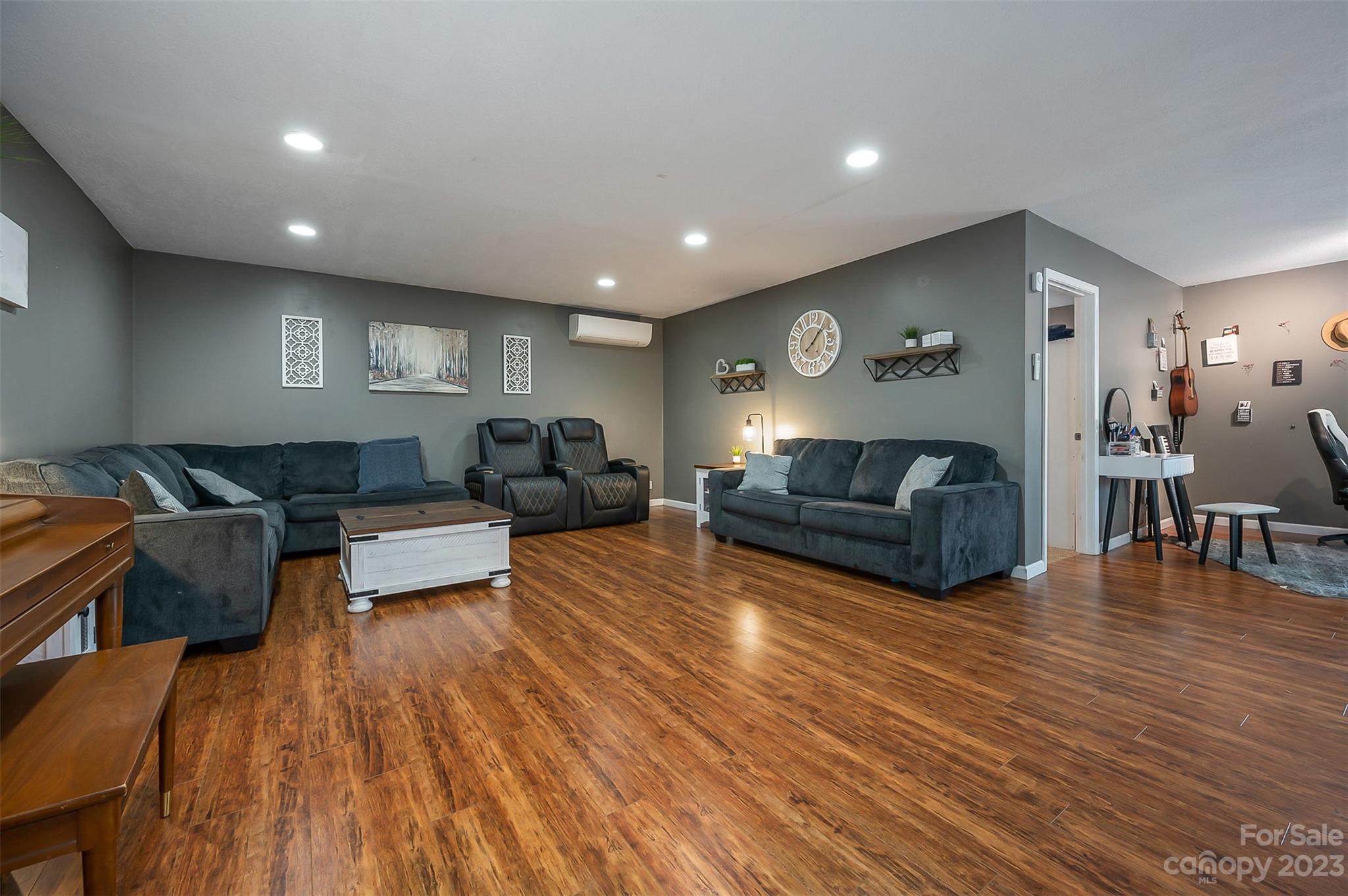 1251 Terrys Creek Road Zirconia, NC 28790 - Photo 23 of 48 a living room with furniture and a wooden floor