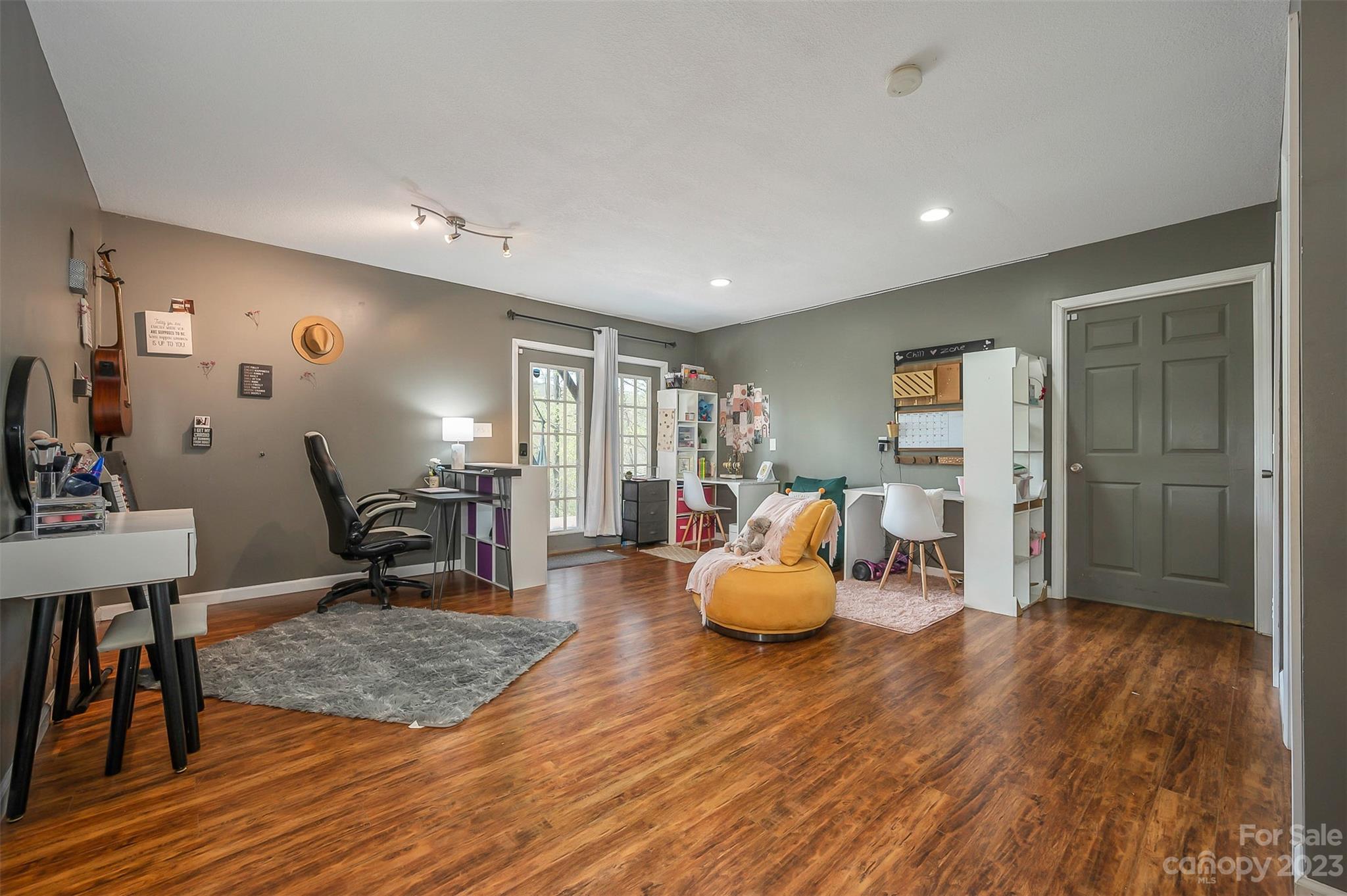 1251 Terrys Creek Road Zirconia, NC 28790 - Photo 25 of 48 a living room with furniture and wooden floor