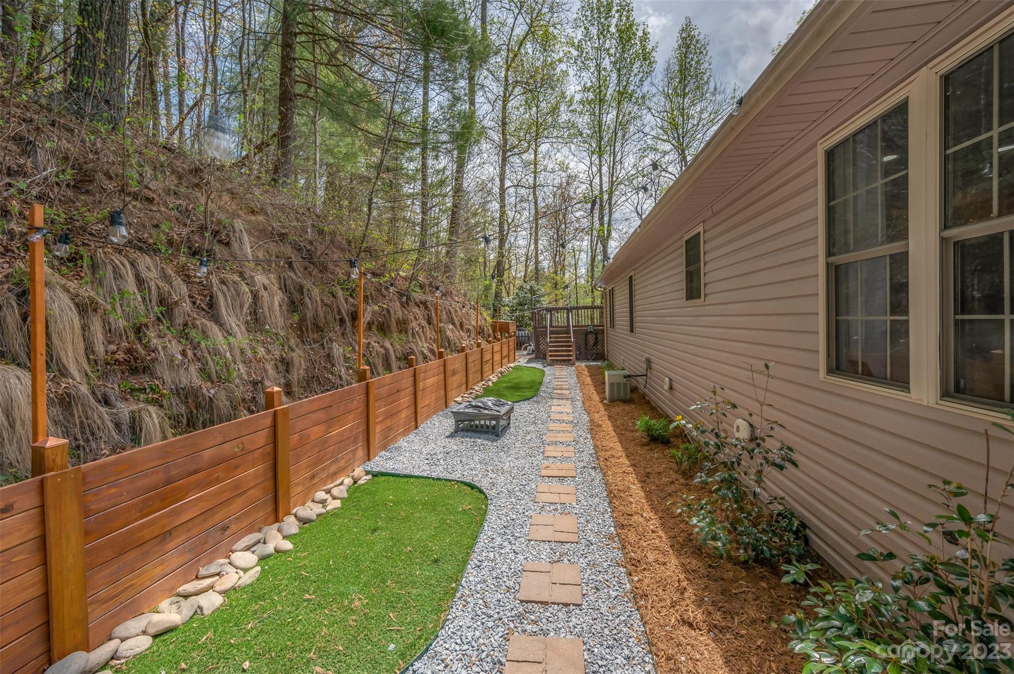 1251 Terrys Creek Road Zirconia, NC 28790 - Photo 35 of 48 a view of a pathway with a house in the background