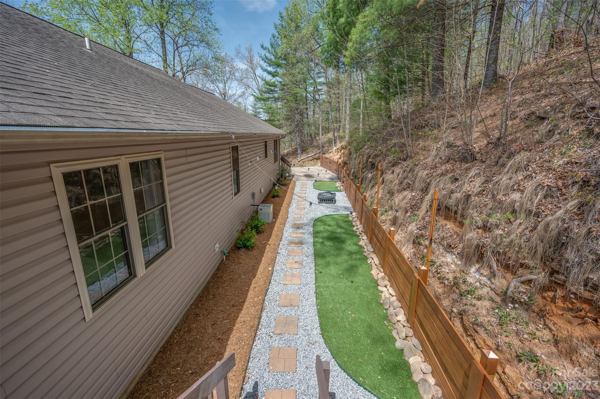 1251 Terrys Creek Road Zirconia, NC 28790 - Photo 37 of 48 a view of a house with backyard