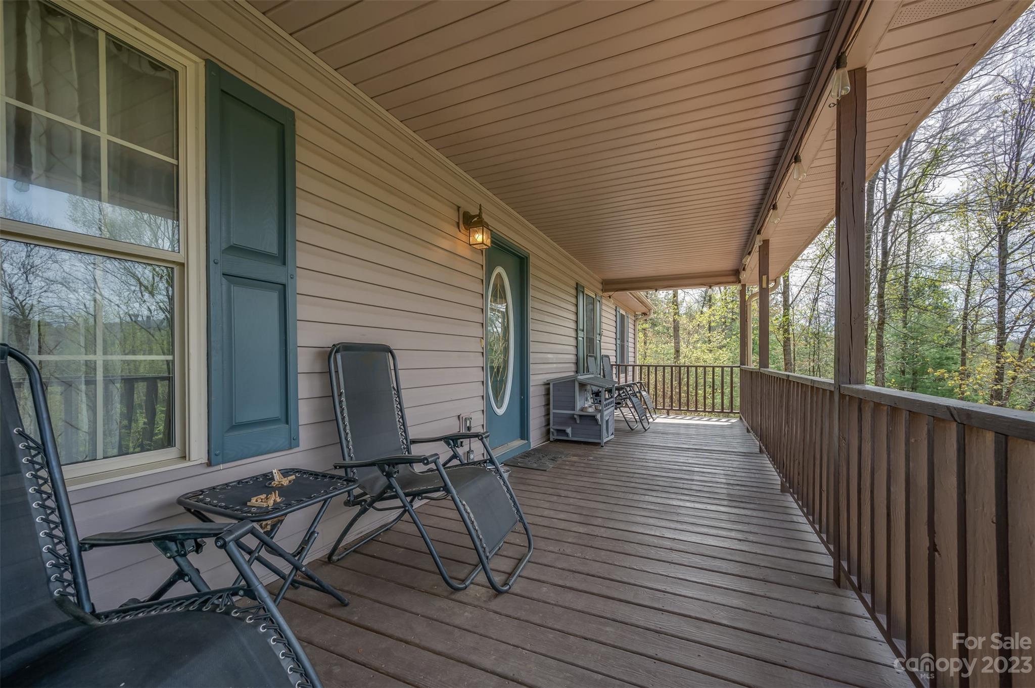 1251 Terrys Creek Road Zirconia, NC 28790 - Photo 4 of 48 a view of a patio with wooden floor