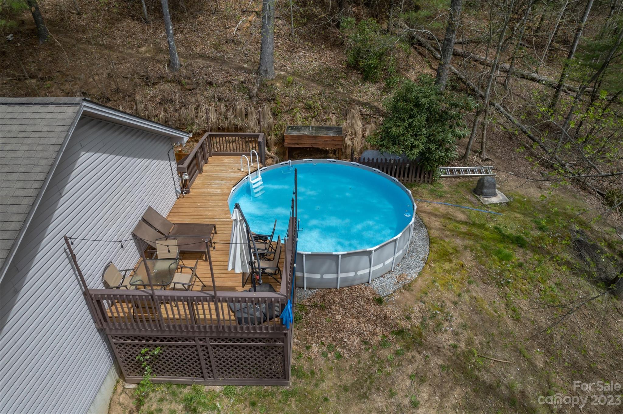 1251 Terrys Creek Road Zirconia, NC 28790 - Photo 42 of 48 a view of balcony with wooden floor and outdoor seating