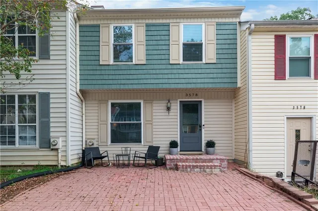 a backyard of a house with seating space