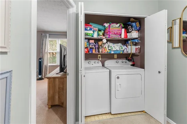 a bedroom with a bed and a baby crib
