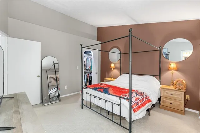 a bathroom with a toilet a sink and a mirror