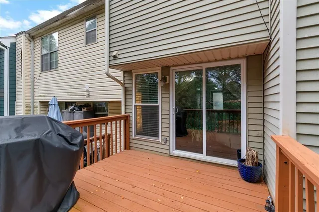a view of balcony with wooden floor