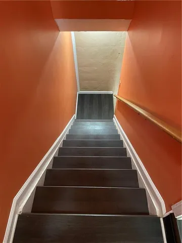 a kitchen with a refrigerator sink and cabinets