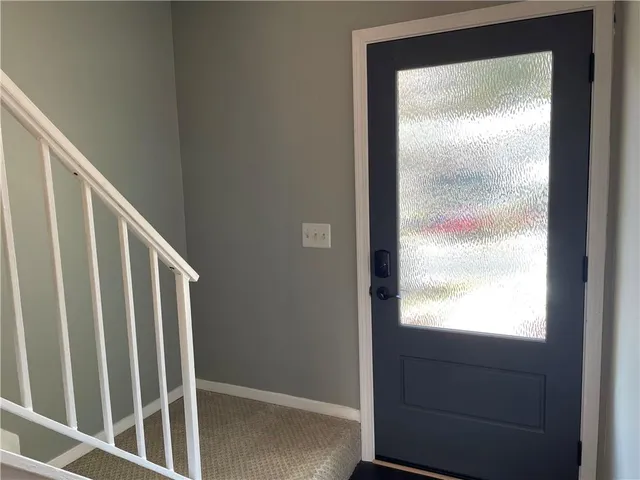 a view of a kitchen with wooden floor and electronic appliances