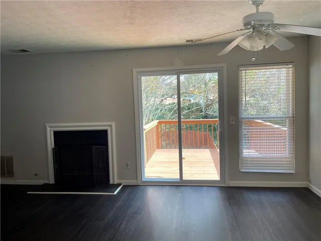 a balcony with wooden floor and fence