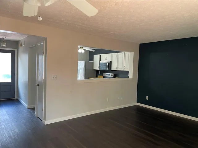 a view of empty room with windows