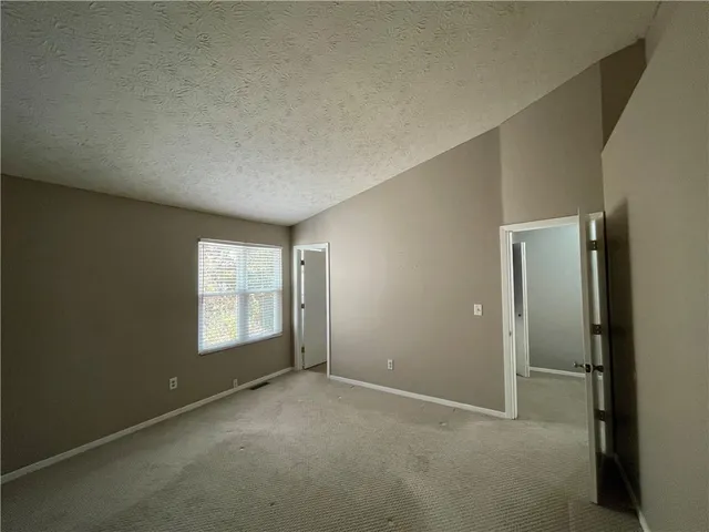 a view of a pathway with a backyard