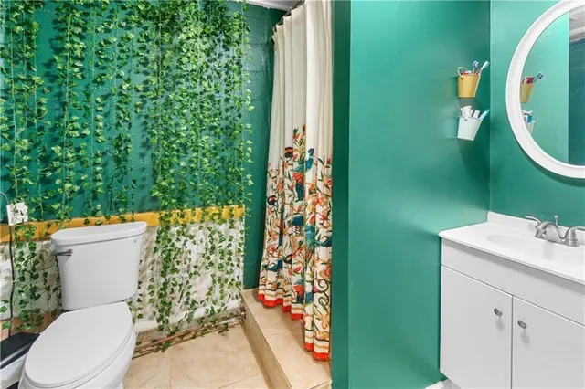 a view of a livingroom with workspace and a window