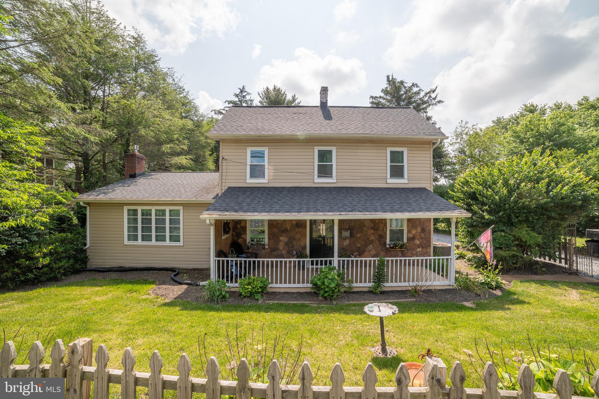 1501 Long Corner Road Mount Airy, MD 21771 - Photo 105 of 116 a view of a house with swimming pool next to a yard