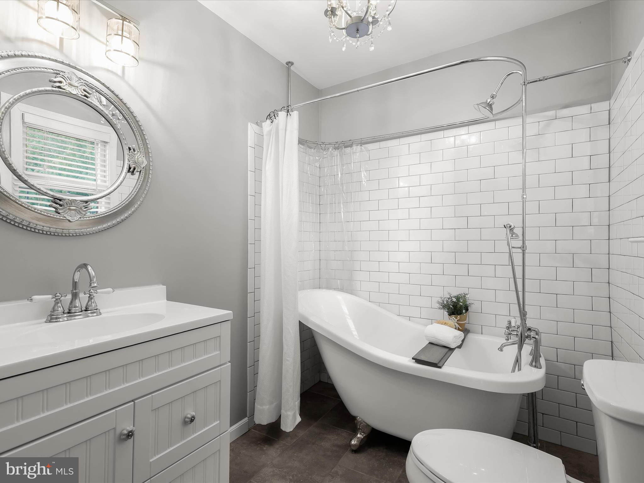1501 Long Corner Road Mount Airy, MD 21771 - Photo 8 of 116 a bathroom with a toilet a sink and mirror