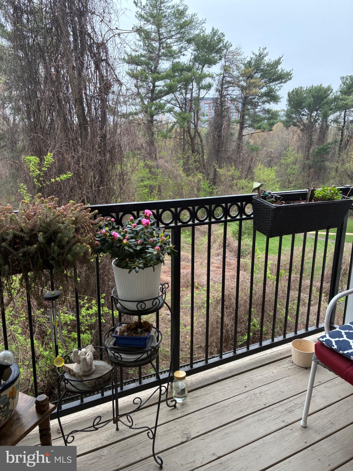 1571 Spring Gate Dr., Unit 6206 McLean, VA 22102 - Photo 14 of 26 Serene balcony with lush greenery.