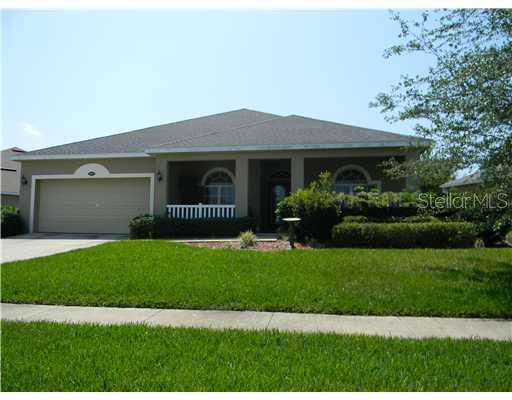 3875 Beacon Ridge Way Clermont, FL 34711 - Photo 1 of 1 a view of house with backyard and garden