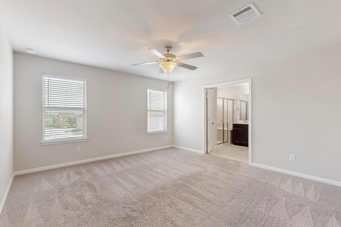 2908 Harvester Lane Round Rock, TX 78664 - Photo 17 of 40 a view of an empty room with a window