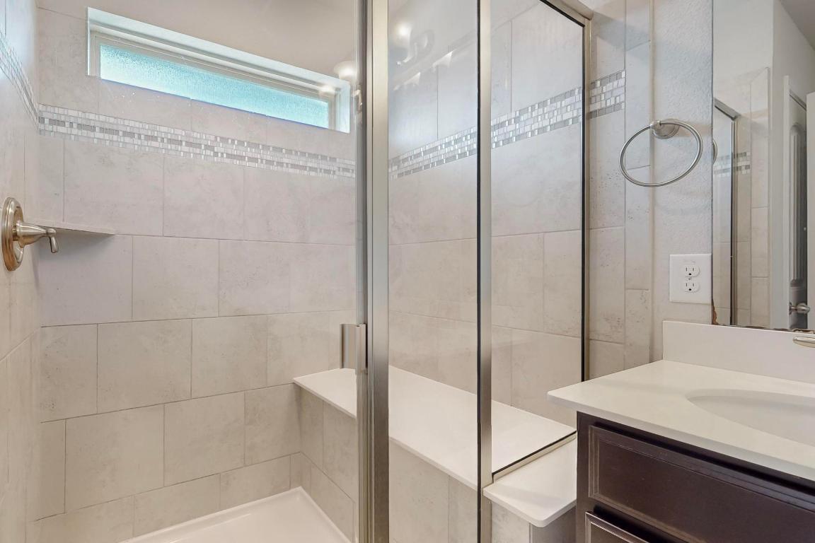 2908 Harvester Lane Round Rock, TX 78664 - Photo 22 of 40 a bathroom with a shower and a sink